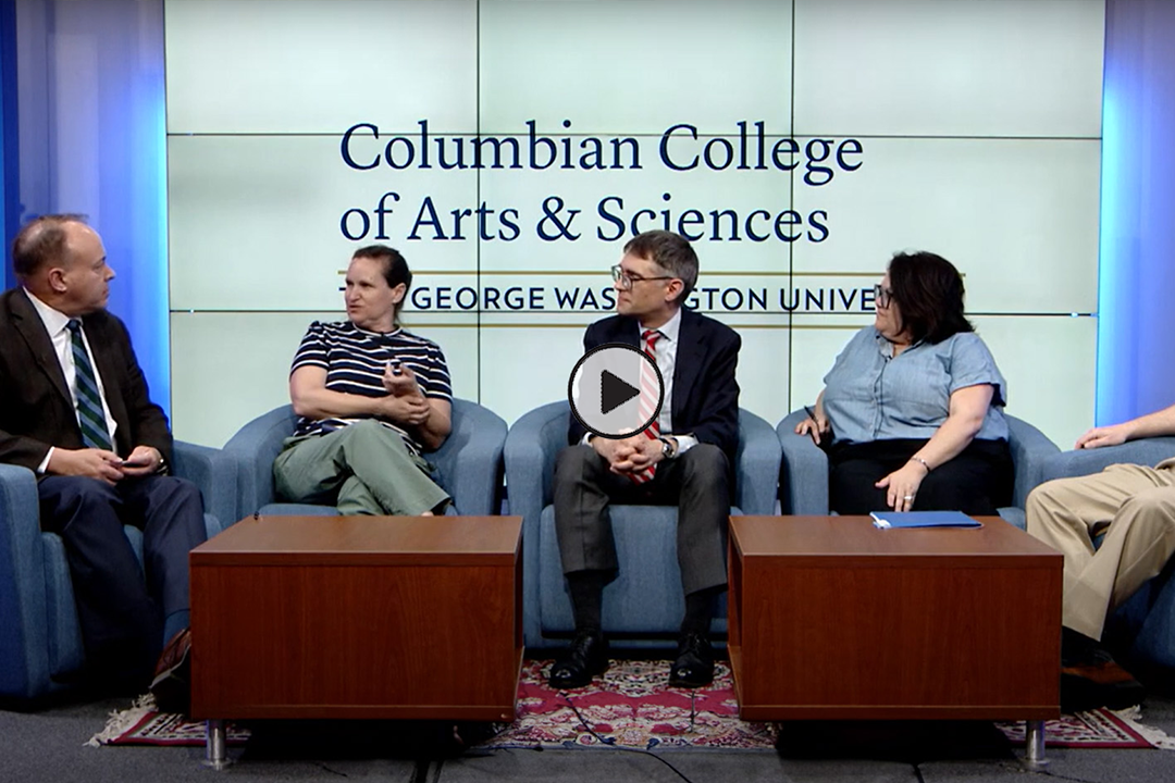 CCAS Dean Paul Wahlbeck and faculty members on stage having a panel discussion
