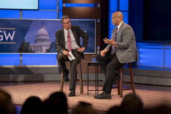 Cory Booker and Frank Sesno on stage at the Sesno Series
